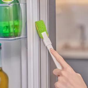 Mini cleaning brush with replaceable sponge head for household refrigerator gaps and kitchen use.
