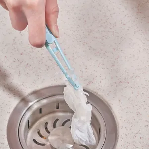 Kitchen sink cleaning tool, plastic drain hair catcher and debris removal clip, light blue.