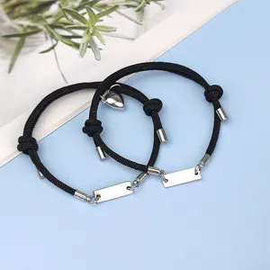 Stainless steel couple matching bracelets with black woven rope, magnetic heart design, chic jewelry.