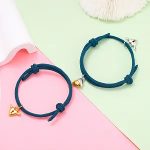 Couple magnetic heart woven rope bracelet set for lovers stylish alloy jewelry gift accessory.