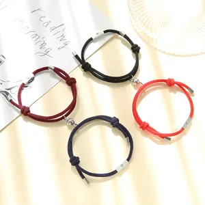Magnetic woven couple bracelets with sun and moon charms, stylish friendship rope jewelry sets.