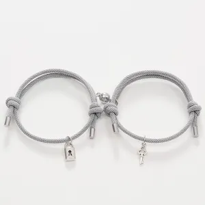 Couple grey woven rope bracelets with magnetic lock and key charms, romantic jewelry gift set.