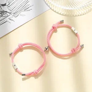 Pink braided rope couple magnetic matching bracelets with sun and moon charm for lovers.