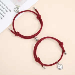 Couple magnetic attraction red braided rope bracelets with cute smile face pendants for lovers.
