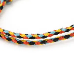 Detailed view of the handmade multi-color braided cotton rope bracelet craftsmanship.