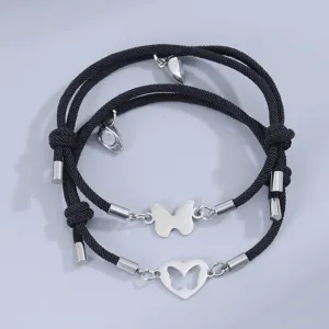 Set de pulseras de pareja trenzadas de mariposa y corazón de acero inoxidable con imán.