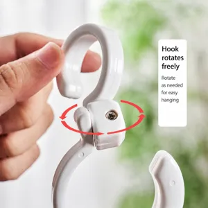 White plastic rotating S-hook for home organization, versatile swivel hanging hook.