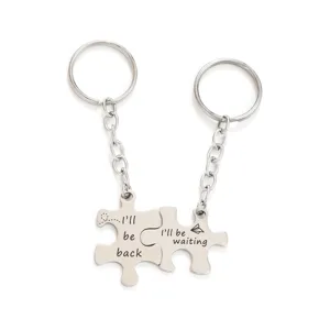 Detailed view of stainless steel couple puzzle keychain with engraved sweet romantic text.