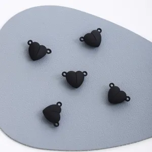 Detail shot of black heart magnetic clasp connectors for DIY necklace bracelet jewelry making.
