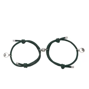 Bracciali di coppia intrecciati verde scuro con chiusura magnetica e ciondoli montagna onda