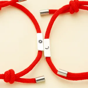 Red string magnetic couple bracelets featuring sun and moon charms, matching bestie jewelry.