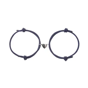 Detailed view of couple magnetic heart braided rope bracelets, stylish navy blue design.