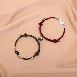 Couple magnetic matching Tai Chi braided rope bracelets in black and red for lovers.