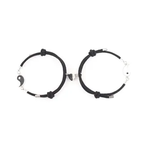 Couple magnetic attraction black braided rope bracelet set featuring tai chi and heart charms.