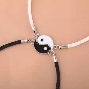 Yin Yang Tai Chi magnetic couple bracelet detail close-up showcasing braided Milan rope design.