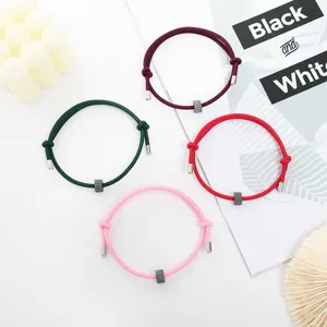 Minimalist tungsten carbide bead woven rope bracelet detail, unisex everyday survival accessory.