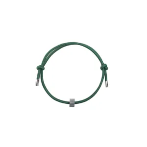 Green woven rope bracelet with metal tips and central metallic bead for everyday wear.