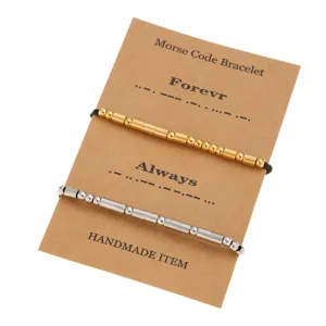 Stainless steel Morse code couple bracelet set in gold and silver with kraft card.