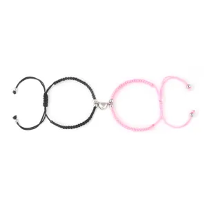 Set di bracciali intrecciati a cuore magnetico di coppia, gioielli in corda fatti a mano.