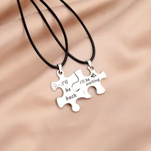 Stainless steel couple puzzle necklace set with black cord, matching jewelry for lovers.