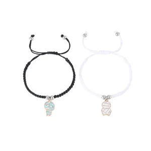 Adjustable braided couple bracelets featuring cute mummy charms, matching black and white set.