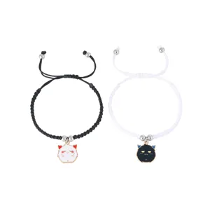 Matching couple braided bracelets with cute cartoon devil cat charms, adjustable rope size for daily wear.