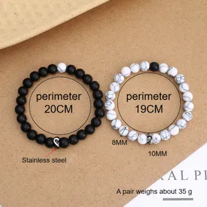 Set di bracciali di perle di coppia con ciondolo a cuore in acciaio inossidabile.