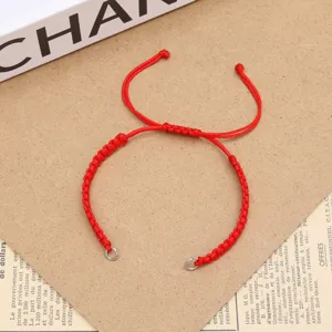 DIY red woven cord bracelet detail view, handmade string jewelry accessory with steel rings.