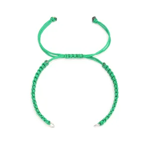 Green DIY handmade braided flat knot bracelet cord with stainless steel rings detail.