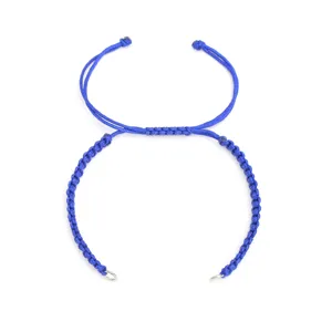 Close-up detail of the blue handmade braided cord bracelet with small stainless steel rings.