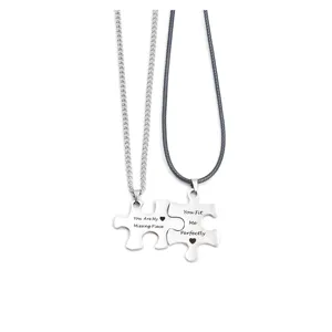 Stainless steel couple puzzle pendant necklace detail showcasing engraved romantic text.
