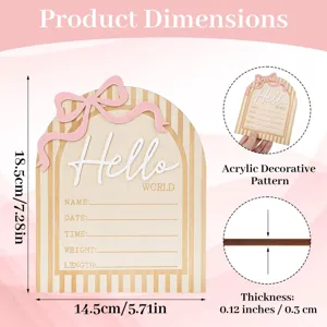 Wooden newborn milestone announcement card with hello world design and pink bow decoration.