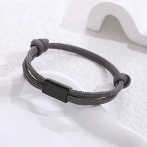 Handcrafted grey paracord bracelet with black stainless steel tube detail unisex minimalist