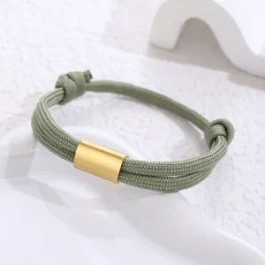 Handmade green paracord stainless steel bracelet with gold metal tube detail for daily wear.