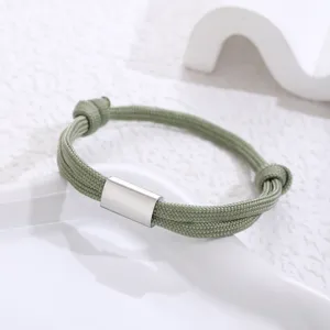 Handmade paracord stainless steel bracelet detail view, minimalist green woven rope design.