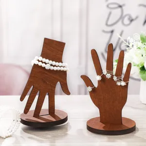 Wooden hand jewelry display stand, creative bracelet and ring organizer for home desktop decor.