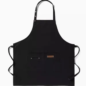 Grembiule da lavoro professionale in tela nera con pratiche tasche e comode bretelle.