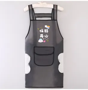 Vue détaillée du tablier de cuisine en TPU imperméable avec essuie-mains et joli motif.