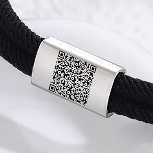 Handcrafted black paracord stainless steel bracelet with custom QR code engraved metal tag.