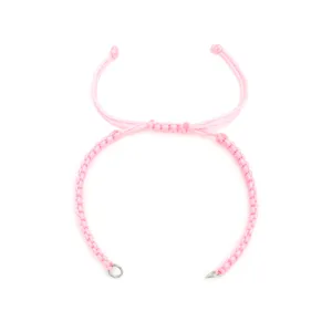 DIY pink braided cord bracelet detail, featuring adjustable knot and steel rings for charms.
