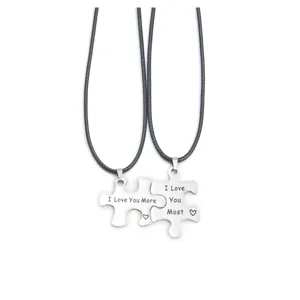 Stainless steel couple puzzle necklace detail view, matching interlocking puzzle pendant.