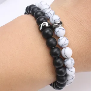 Set bracciali di coppia in pietra nera opaca e bianca con cuore magnetico per lui lei.