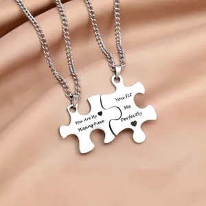 Stainless steel couple puzzle piece necklace set with engraved sweet love quotes and chains.