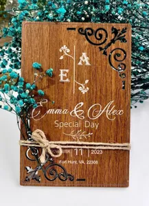 Custom laser cut wooden wedding invitation card with preserved flowers and twine decor.
