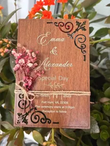 Wooden wedding invitation laser cut rustic card with preserved flowers and custom engraved text.