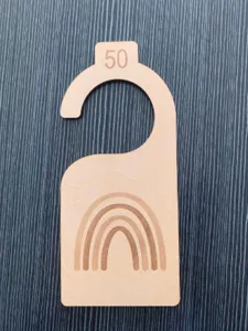 Wooden baby closet divider featuring cute rainbow engraving and number 50 for kids room