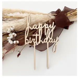 Wooden happy birthday cake topper close up detail view with rustic floral decorations.