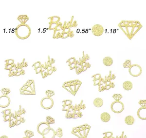 Gold glitter bride to be confetti table decorations with diamond and ring shapes for weddings.