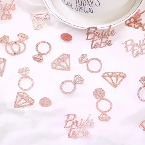 Rose gold glitter confetti details, diamond and ring shapes for wedding and party table decor.