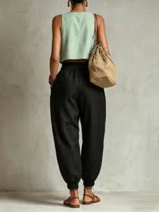 Pantalon sarouel décontracté en lin pour femme, taille haute élastique, coupe ample confortable.